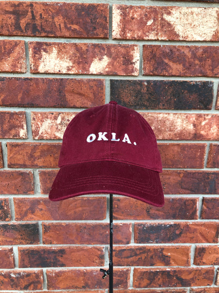 O K L A. Hat